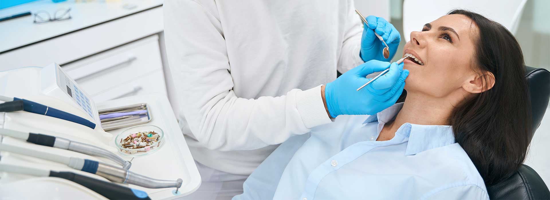 Dentist doing a dental check up for his patient