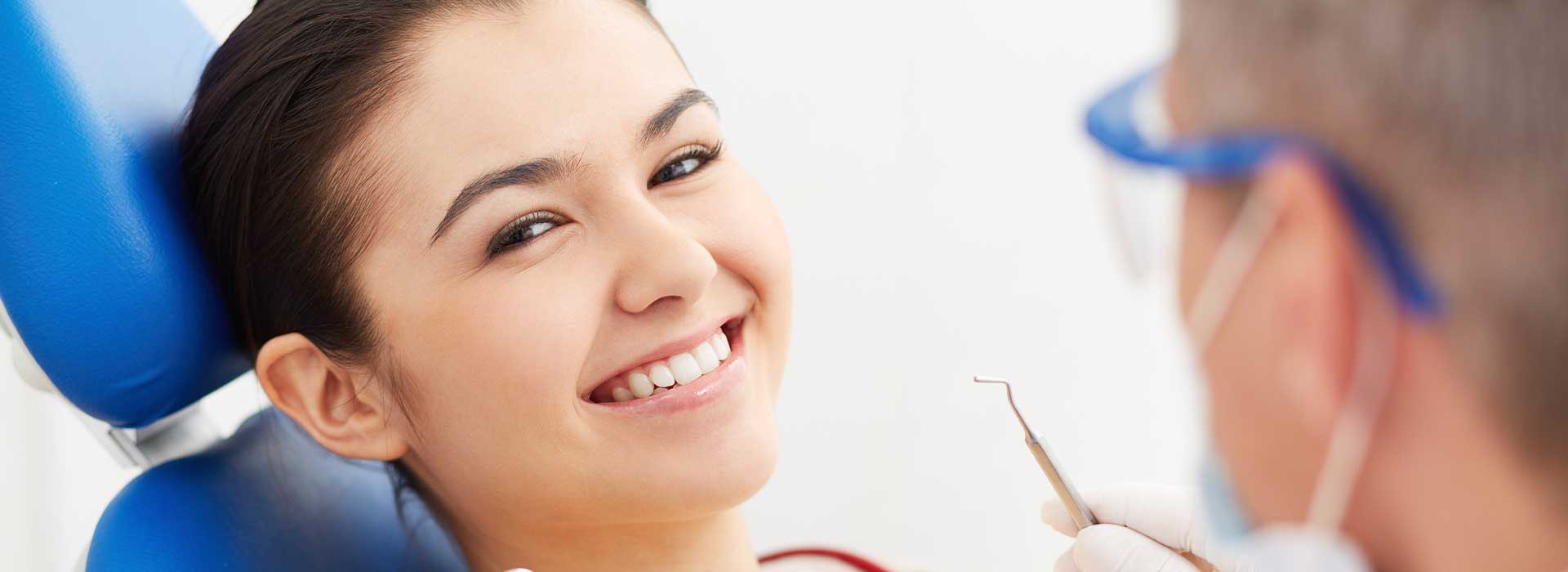 Dentist doing dental treatments for his patient