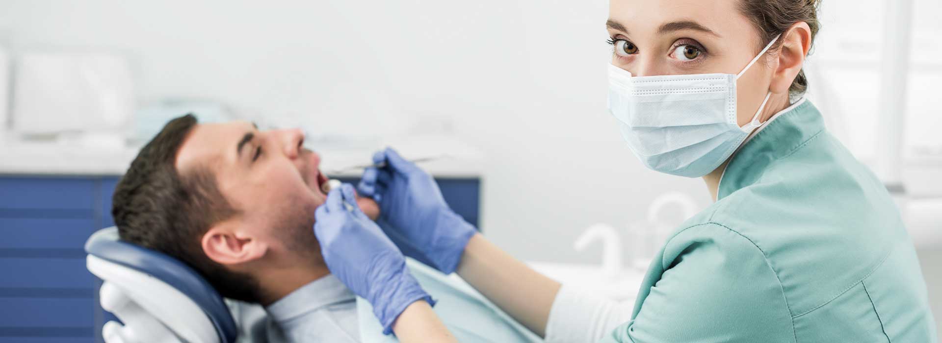 Lady dentist doing full mouth reconstruction for her patient